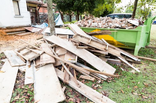 Professional team conducting office clearance in a modern office space in Manor Park